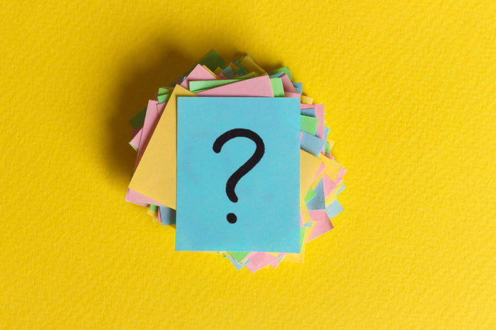 colorful note papers with question marks written on them